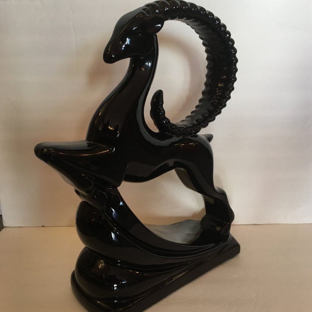 Impressive 1950's decorative ceramic ibex sculpture in motion. Made by Haeger, one of the leading makers of decorative objects in the 20th century and maintaining its original sticker on the bottom. Perfect example of mid-century decorative objects. Dimensions:16ʺW × 6ʺD × 20ʺH Condition:Very Good Condition, Original Condition Unaltered, No Imperfections Condition Note: Perfect Styles: Figurative, Mid-Century Modern, Modern Materials:Ceramic
